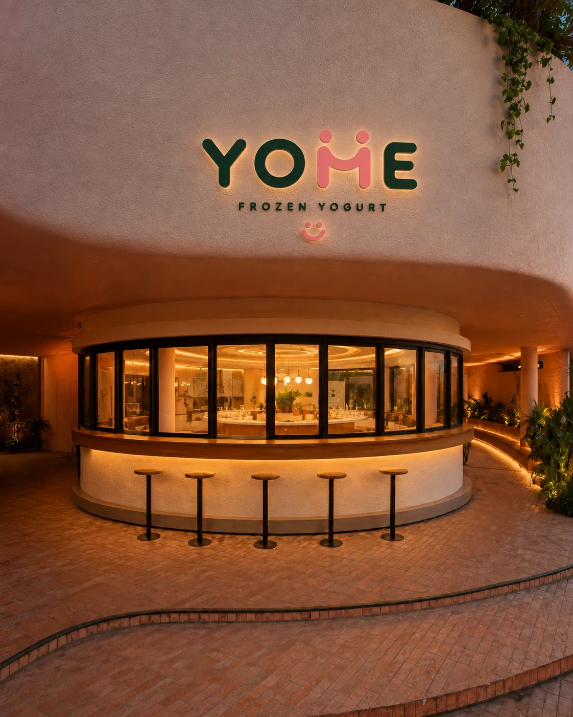 Future YOME frozen yogurt store in Berawa with curved black windows and timber outdoor seating